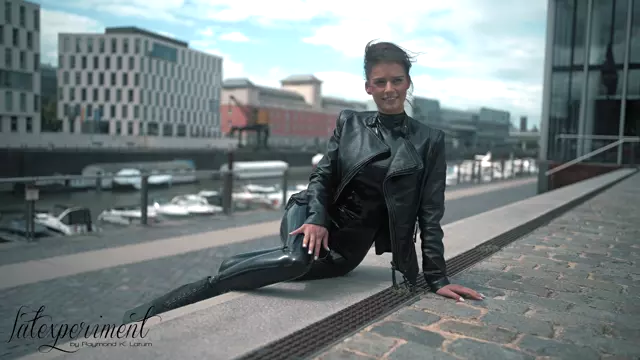 Poster: Amanda Jones - Latex Lifestyle On Platform Boots - LateXperiment